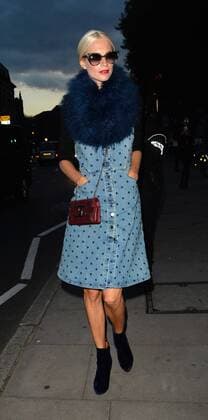 Model Poppy Delevingne is pictured arriving at the House of Holland show at London Fashion Week. The 29-year-old wears a denim dungaree-style dress, velvet ankle boots and as seriously fluffy scarf. SEPTEMBER 19th 2015  LTNx152921