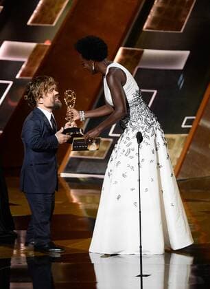 Actor Peter Dinklage receives the award for Outstanding Supporting Actor in a Drama Series for Game of Thrones from actress Viola Davis onstage during the 67th Primetime Emmy Awards in the Microsoft Theater in Los Angeles on September 20, 2015.  LAP20150920825 KENxMATSUI