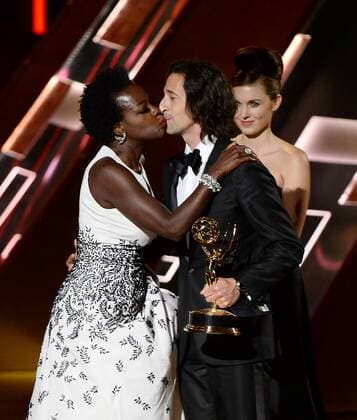 Actress Viola Davis accepts the award for Outstanding Lead Actress in a Drama Series for How to Get Away with Murder from actor Adrien Brody during the 67th Primetime Emmy Awards in the Microsoft Theater in Los Angeles on September 20, 2015.  LAP20150920810 KENxMATSUI