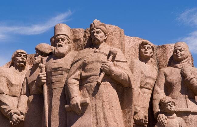 Statues of Ukraine heroes at Rainbow Arch in park of city life in Center City in Kiev Ukraine McPBBA McPBBA