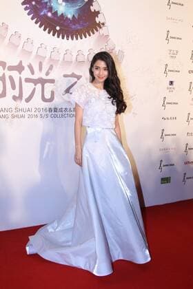 BEIJING, CHINA - SEPTEMBER 22: (CHINA OUT) Actress Angelababy poses on the red carpet during the Zhang Shuai 2016 S S Collection & Haute Couture at National Agricultural Exhibition Center on September 22, 2015 in Beijing, China.  CFP473290404