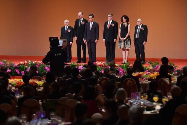 (150924) -- HONG KONG, Sept. 24, 2015 -- Hong Kong Chief Executive Leung Chun-ying (3rd L rear) poses for photos with winners of the Shaw Prize in Hong Kong, south China, Sept. 24, 2015. A presentation ceremony of the annual Shaw Prize was held Thursday in Hong Kong, with five U.S. and German scientists commended for their prominent work in astronomy, life science and medicine, and mathematical science. ) (zkr) CHINA-HONG KONG-SHAW PRIZE(CN) WuxYongjian 