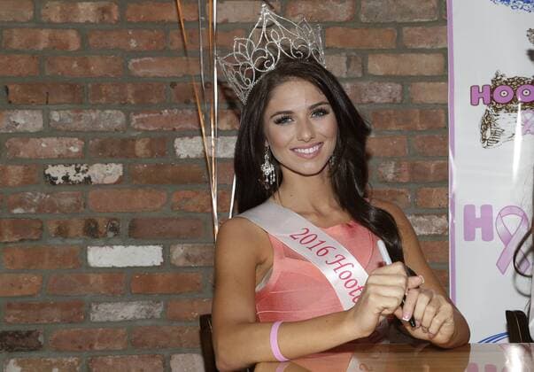 2016 Hooters Calendar cover girl Meagan Pastorchik signs calendars greeting customers and fans at Hooters Restaurant in New York City on October 1, 2015. The 2016 Hooters Calendar Girls were selected from over 25,000 Hooters girls worldwide.  NYP20151001103 JOHNxANGELILLO