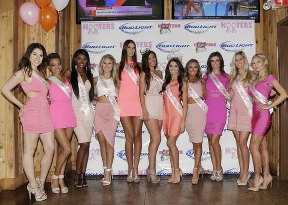 The 2016 Hooters Calendar Girls stand together before signing calendars for customers and fans at Hooters Restaurant in New York City on October 1, 2015. The 2016 Hooters Calendar Girls were selected from over 25,000 Hooters girls worldwide.  NYP20151001113 JOHNxANGELILLO