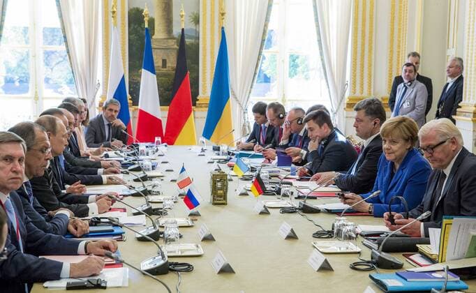 PARIS, FRANCE. OCTOBER 2, 2015. Russian Presidential Aide Yuri Ushakov, Russian Foreign Minister Sergei Lavrov, Russian President Vladimir Putin and French President Francois Hollande (L-R) and German Foreign Minister Frank-Walter Steinmeier, German Chancellor Angela Merkel, Ukrainian President Petro Poroshenko (R-L) hold Ukraine peace talks at the Elysee Palace. Mykhailo Palynchak Press Office of the President of Ukraine TASS  TS00EED5