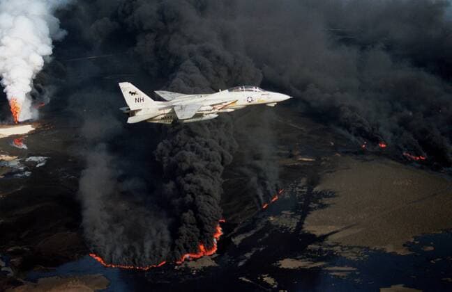 Feb. 1, 1991 - Kuwait - A US Navy F-14A Tomcat in flight over burning Kuwaiti oil wells during Operation Desert Storm February 1, 1991 Kuwait - ZUMAp138