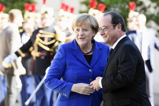 (151002) -- PARIS, Oct. 2, 2015 -- French President Francois Hollande (R) shakes hands with German Chancellor Angela Merkel before their meeting in Paris, France, Oct. 2, 2015. After talks on Ukraine future with leaders from Russia, Ukraine and Germany, French President Francois Hollande said Minsk peace process would be extended to next year in order to meet security conditions to hold elections. ) FRANCE-PARIS-RUSSIA-UKRAINE-GERMANY-TALK THEOxDUVAL 