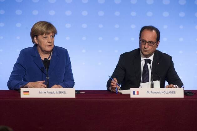 (151002) -- PARIS, Oct. 2, 2015 -- French President Francois Hollande (R) attends a joint press conference together with German Chancellor Angela Merkel in Paris, France, Oct. 2, 2015. Russia warplanes have to strike only Islamic States (IS) targets in Syria amid confusion over Moscow air forces attacks on rebel groups, French President Francois Hollande and German Chancellor Angela Merkel told Russian leader Vladimir Putin at a Paris meeting on Friday. ) FRANCE-PARIS-RUSSIA-UKRAINE-GERMANY-TALK THEOxDUVAL 