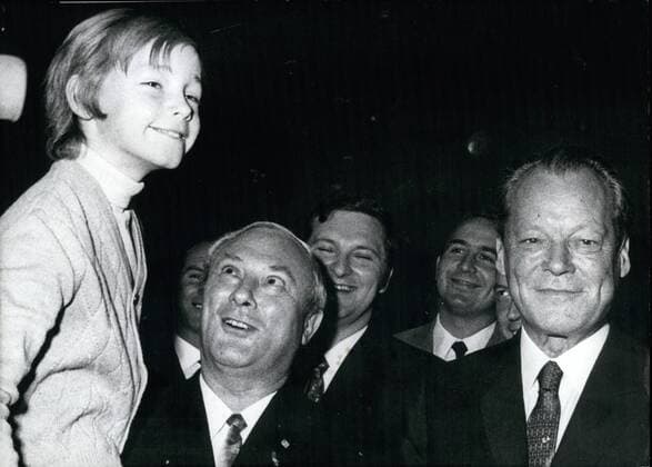 October 8th, 1970 - Federal Minister Georg Leber became 50 on October 7th Ã¢â‚¬âÄœ Georg Leber, the West German Minister of Transport and Postmaster General was celebrating his 50th birthday yesterday. After the war Leber was working as a bricklayer and then he made a career at the Bau-Stein-ErdenÃ¢â‚¬ (building trade union). Since 1966 he has been a member of the West German Cabinet. OPS: Matthias Brandt, the youngest son of Willy Brandt, Minister Leber and West German Chancellor Willy Brandt (from left to right) at the birthday reception. Keystone Photo, October 8th, 1970 - ZUMAk09_