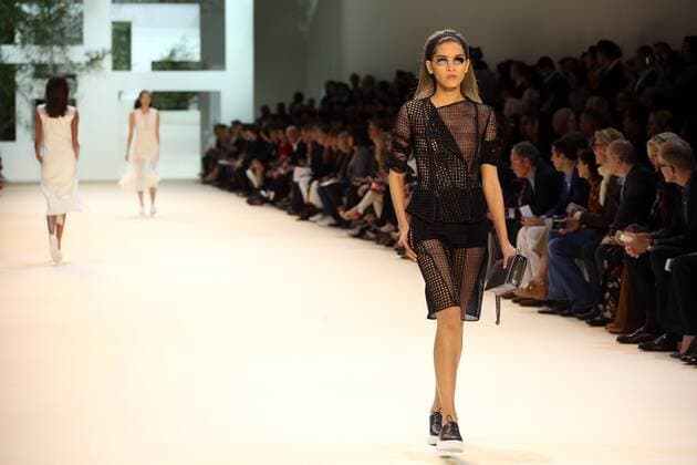 A model takes to the catwalk during the presentation of Akris collection as part of the 2016 Spring-Summer ready-to-wear Fashion Week in Paris, on October 4, 2015.  PAR20151004108 MAYAxVIDON-WHITE