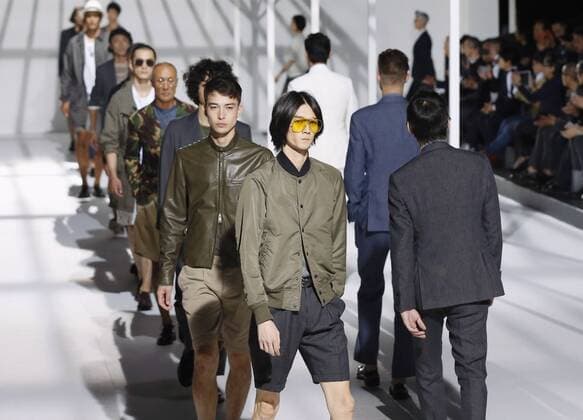 Fashion Week Tokyo Models wearing outfits of TODD SNYDER walk on a runway in Tokyo s Shibuya district as Fashion Week Tokyo begins Oct. 12, 2015. 