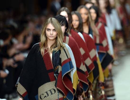 Burberry shares plunge; FTSE 100 trades higher. SOurce - BBC NEWS Cara Delevingne closes the Burberry Prorsum show at London Fashion Week A W 14, Monday, 17th February 2014.  xStephenxLockx xi-Imagesx IIM-11235-0002