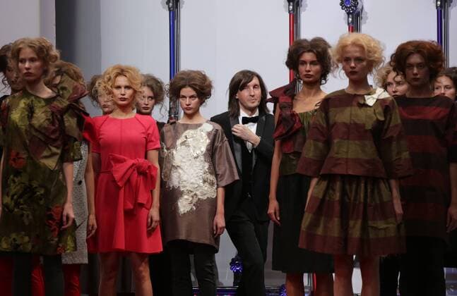 MOSCOW, RUSSIA. OCTOBER 16, 2015. Designer Sergei Sysoyev (C) acknowledges the audience following a fashion show for his collection, at Plus Size Fashion Weekend Show during the 34th Moscow Fashion Week in Gostiny Dvor. Artyom Geodakyan TASS  TS00FFCA