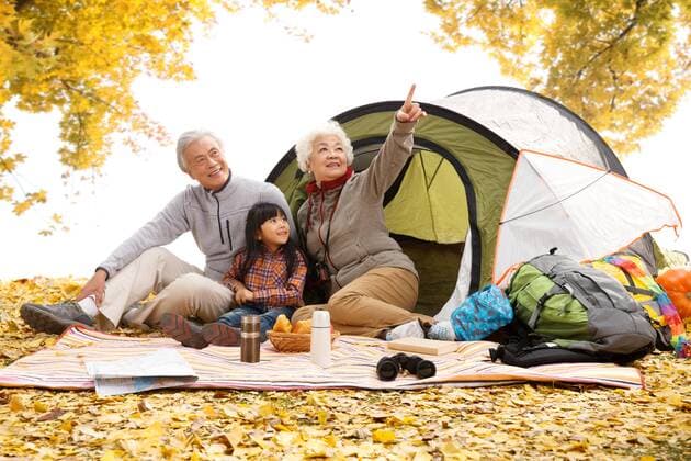 Grandparents and granddaughter are camping.  cpmh-94984f10z