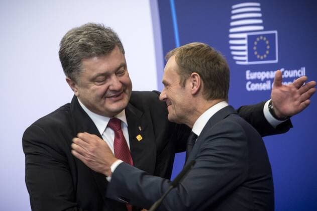 Feb. 12, 2015 - Brussels, Bxl, Belgium - Ukraine s President Petro Poroshenko (L) and Donald Tusk , the president of the European Council hold a press conference during the European Summit of Heads of States and governments at the EU Council headquarters in Brussels, Belgium on 12.02.2015 The EU summit started two hours later than planned, after two of its participants - German Chancellor Angela Merkel and French President Francois Hollande - spent all night negotiating a Ukraine truce deal in Minsk. The European Union leaders are meeting to discuss Greece s economic crisis, EU counterterrorism efforts and the situation in Ukraine. by Wiktor Dabkowski - ZUMAw80