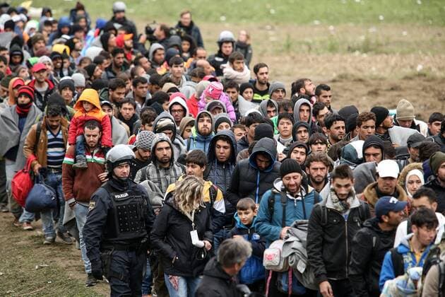 22.10.2015., Brezice, Slovenia - Refugees under heavy police security headed for Austria and Germany from the refugee camp.  PetarxGlebov PIXSELL