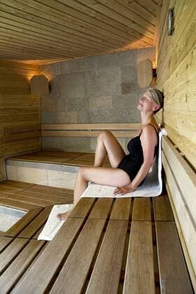 Senior woman relaxing in a sauna model released Symbolfoto property released  TOYF001283
