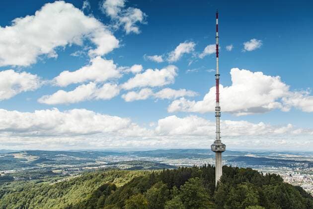 Switzerland, Zurich, Scenic view from Uetliberg with communication tower and mountain range  BZF000251