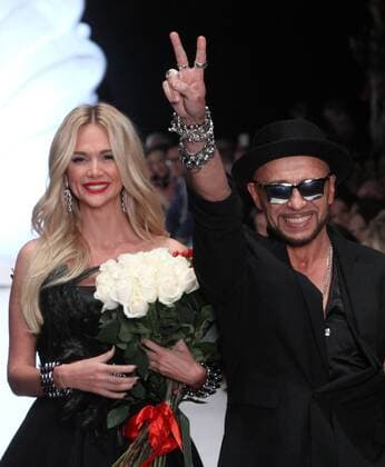 MOSCOW, RUSSIA. OCTOBER 26, 2015. Model and TV personality Viktoria Lopyreva (L) and designer Igor Gulyaev acknowledge the audience following a fashion show for Igor Gulyaev spring summer collection on the closing day of the 2015 Mercedes Benz Fashion Week Russia at Manege Central Exhibition Hall. Sergei Vinogradov TASS  TS010986