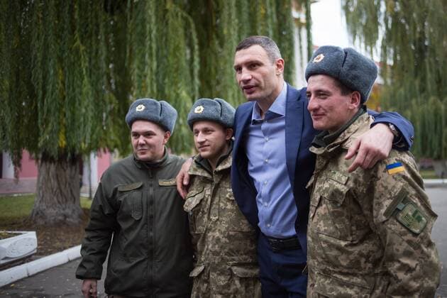 Oct. 25, 2015 - Ukraine - Kiev s current mayor and former heavyweight boxing champion Vitali Klitschko pose for photo with soldiers after casting his vote at a polling station in an regional and local elections in Kiev. Ukraine - ZUMAp133