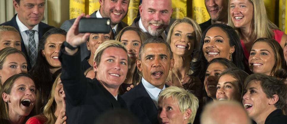 Abby Wambach holds the smartphone as U.S. President Barack Obama takes a selfie as he honors the U.S. Women s 2015 World Cup champion team at an event in the East Room of the White House in Washington DC on October 27, 2015. Obama said they inspired millions of girls to dream bigger .  WAP2015102701 PATxBENIC