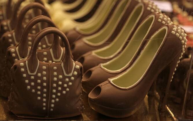 Chocolate in the form of handbags and shoes is seen during the inauguration of the 21st annual Salon du Chocolat in Paris on October 27, 2015. The show, the world s biggest dedicated to chocolate, brings together fashion designers and chocolatiers from around the world.  PAR20151027749 DAVIDxSILPA