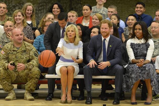 HRH Prince Harry (2nd,R), First Lady Michelle Obama (R) and Dr. Jill Biden avoid the ball during a basketball game by wounded service members, October 28, 2015, at Ft. Belvoir, Virginia. The event is a celebration of the Joining Forces Initiative and the upcoming 2016 Invictus Games in Orlando, Florida, in which wounded military personnel compete in sporting competition.  WAP20151028501 MIKExTHEILER