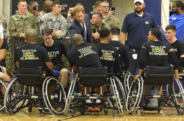 HRH Prince Harry thanks members of the basketball team at the conclusion of a game by wounded service members, October 28, 2015, at Ft. Belvoir, Virginia. The event is a celebration of the Joining Forces Initiative and the upcoming 2016 Invictus Games in Orlando, Florida, in which wounded military personnel compete in sporting competition.  WAP201510285011 MIKExTHEILER