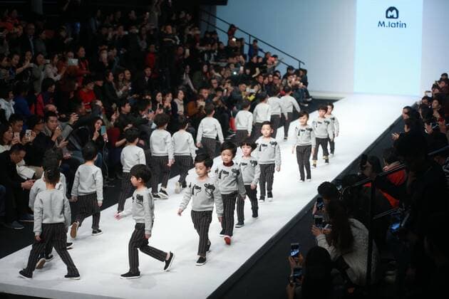 BEIJING, Oct. 28, 2015 -- Child models present creations designed by Li Lieqing at the M.latin Children s Wear Collection during the China Fashion Week in Beijing, capital of China, Oct. 28, 2015. ) (ry) CHINA-BEIJING-FASHION WEEK (CN) ChenxJiannan 