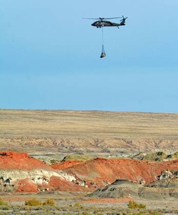 Oct. 29, 2015 - Albuquerque, NM, U.S. - A New Mexico National Guard Black Hawk Helicopter carries a skull of an adult Pentaceratops from the Bisti Ah-shi-sle-pah Wilderness Study Area in the Four Corners region of New Mexico. Thursday, Oct. 29, 2015. Albuquerque U.S. - ZUMAab1_