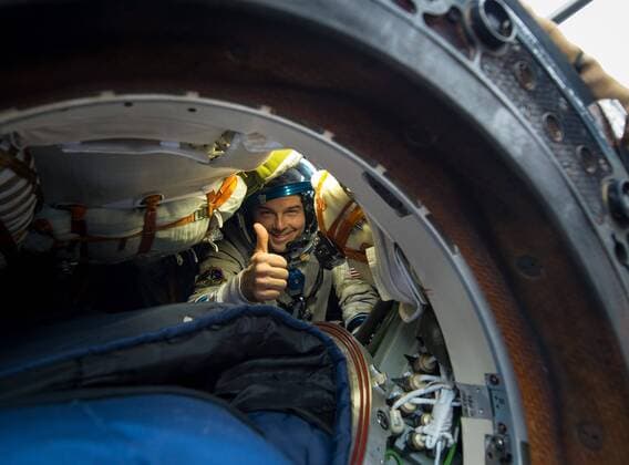 Nov 10, 2014 - Arkalyk, Kazakhstan - ISS Expedition 41 crew Alexander Gerst of the European Space Agency, left, Commander Max Suraev of the Russian Federal Space Agency, center, and NASA astronaut Reid Wiseman, sit in chairs outside the Soyuz TMA-13M capsule just minutes after they landed in a remote area November 10, 2014 near Arkalyk, Kazakhstan. Suraev, Wiseman and Gerst returned to Earth after more than five months onboard the International Space Station where they served as members of the Expedition 40 and 41 crews. - ZUMAz03