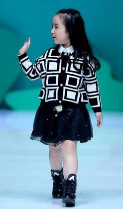 (151101) -- BEIJING, Nov. 1, 2015 -- A child shows a creation of Showkids Chen Juanhong Children s Wear Collection during China Fashion Week in Beijing, capital of China, Nov. 1, 2015. ) (zkr) CHINA-BEIJING-FASHION WEEK(CN) ChenxJianli 