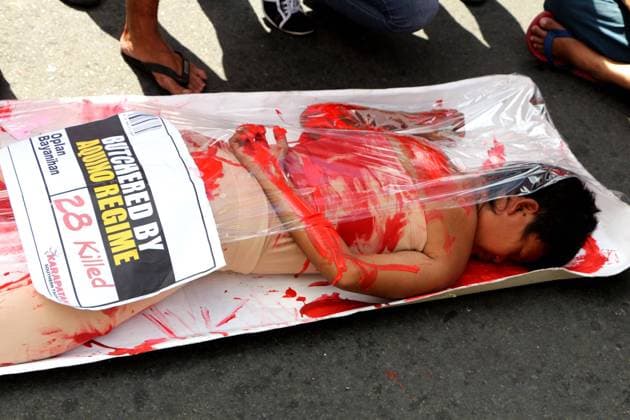Dec. 10, 2014 - Manila, Philippines - Artist shows how human rights is violated in the Aquino government on the commemoration of the 66th International Human Rights Day in Manila.  - ZUMAp13
