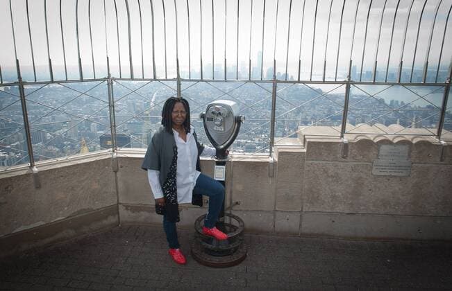 Oct. 28, 2014 - Manhattan, New York, U.S. - WHOOPI GOLDBERG lights The Empire Building orange to celebrate the 2014 Greenwich Village Halloween Parade, Tuesday, October 28, 2014. - ZUMAb09