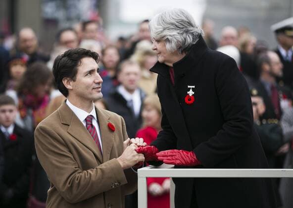 (151111) -- OTTAWA, Nov. 11, 2015 -- Canadian Prime Minister Justin Trudeau shakes hands with Silver Cross Mother Sheila Anderson during Remembrance Day ceremonies at the National War Memorial in Ottawa, Canada, Nov. 11, 2015. ) CANADA-OTTAWA-REMEMBERANCE DAY ChrisxRoussakis 