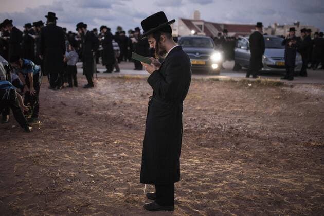 Oct. 2, 2014 - Netanya, Israel - Ultra Orthodox Jews from the Tzanz Hassidic group pray during the Tashlich or Tashlikh ceremony. Tashlich, Hebrew for Casting-Off is a Jewish practice preformed before the holyday of Yom Kippur near a large water source, in which one s sins are being thrown away symbolically by emptying pockets from pieces of bread, and tossing them to the water.  - ZUMAm13