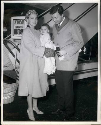 1958 - Idlewind Airport, N.Y., Sept. 6 Movie actress Leslie Caron, her 5 month old son Christopher and husband, Peter Hall arrive at Idlewind today via TWA from London where she was been making a movie Gigi New York U.S. - ZUMAk09_