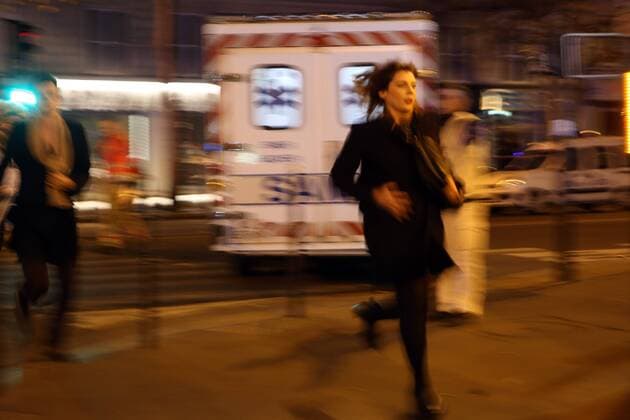 Nov. 13, 2015 - Paris, France - Victims of the shooting at the Bataclan concert venue in central Paris run for safety 14 November 2015. More than one hundred people were killed and many more wounded when gunmen opened fire inside the venue as the French capital has been the target of a series of deadly attacks. Paris France - ZUMAv111