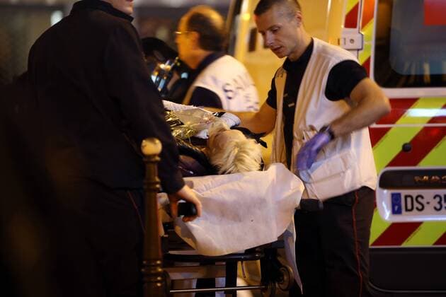 Nov. 14, 2015 - Paris, France - CORBIS OUT = Victims of the shooting at the Bataclan concert venue in central Paris are being evacuated to receive first aid. More than one hundred people were killed and many more wounded when gunmen opened fire inside the venue as the French capital has been the target of a series of deadly attacks. Paris France - ZUMAv111