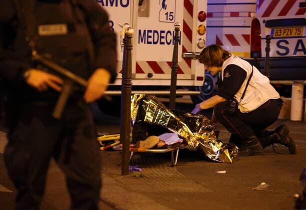Nov. 14, 2015 - Paris, France - CORBIS OUT = Victims of the shooting at the Bataclan concert venue in central Paris are being evacuated to receive first aid. More than one hundred people were killed and many more wounded when gunmen opened fire inside the venue as the French capital has been the target of a series of deadly attacks. Paris France - ZUMAv111