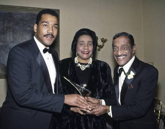Dec. 12, 1988 - Washington, District of Columbia, U.S - L-R Dexter Scott King his mother Coretta Scott King and Sammy Davis Jr. hold the Victory award that is bestowed by the National Rehabilitation Hospital (NRH) each year on persons exemplifying tenacity and courage in overcoming serious obstacles. The Victory Awards were created by the NRH in 1986 to celebrate the Victory of the Human Spirit. Washington U.S. - ZUMAr142
