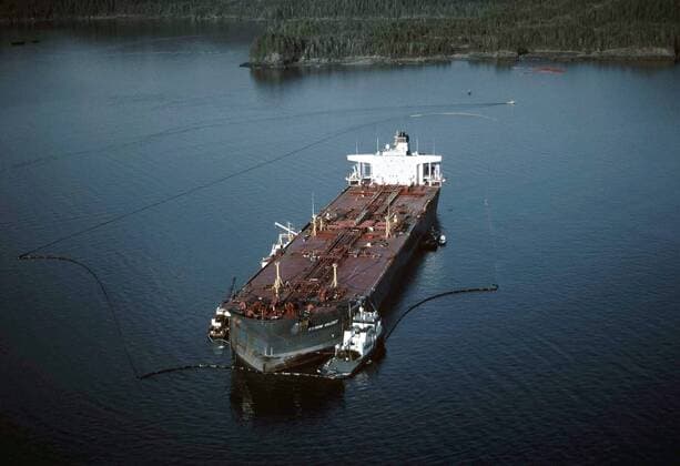 April 1, 1989 - Prince William Sound, AK, United States of America - Aerial view of the Exxon Valdez oil tanker after moving to safe location near Naked Island as clean up efforts continue May 1, 1989 in Prince William Sound, Alaska. The Exxon Valdez ran aground on Bligh Reef in Prince William Sound spilling at least 11 million gallons of crude oil in the pristine waters March 23, 1989. Prince William Sound United States of America - ZUMAp138