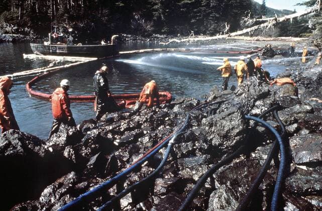 March 28, 1989 - Prince William Sound, AK, United States of America - Workers steam blast rocks and wash down the shoreline soaked in crude oil from the leaking tanker Exxon Valdez after running aground on Bligh Reef in Prince William Sound spilling at least 11 million gallons of crude oil in the pristine waters March 28, 1989 in Prince William Sound, Alaska. Prince William Sound United States of America - ZUMAp138