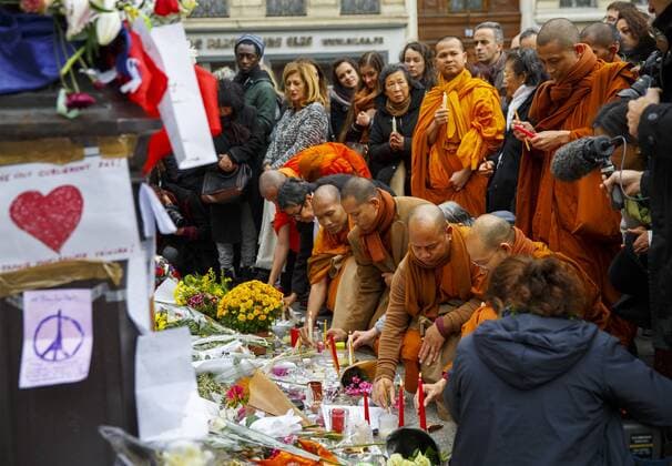 Nov. 16, 2015 - Paris, France - Paris, France. Buddhist monks visit a memorial outside Bataclan Cafe in Paris, France following the Paris terror attacks on Monday, 16 November 2015. Paris  - ZUMAl94_