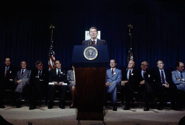 May 9, 2015 - Washington, District of Columbia, United States of America - Washington DC. 6-10-1986.President Ronald Reagan is presented with a copy of the 15 27 33 tax brackets during a briefing on tax reform in room 450 OEOB. .Reagan stated And by now you know that what we re proposing is a tax code with 2 ratesÃ¢â‚¬15 and 27 percent. Eighty percent of the people will be paying either no tax or the lower rate. Maybe we should have said there are 3 bracketsÃ¢â‚¬zero, 15, and 27. Most Americans will enjoy a reduction of their total tax obligation. .Credit: Washington United States of America - ZUMAr142