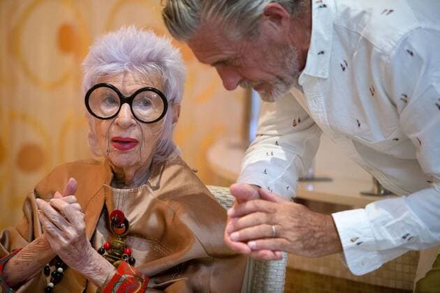 IMAGO ICONS: Iris Apfel Aug. 19, 2014 - Manalapan, Florida, U.S. - Fashion icon and former interior designer Iris Apfel, 93, left, and model Bernard Fouquet, right, pose during a video shoot for a new advertising campaign at Eau Spa Palm Beach on Tuesday, August 19, 2014 in Manalapan. - ZUMAp77