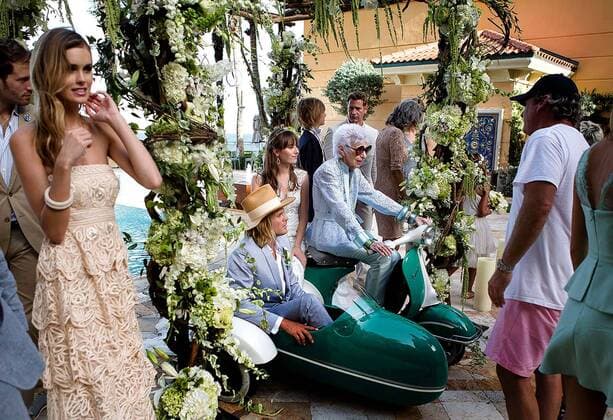 IMAGO ICONS: Iris Apfel Aug. 21, 2014 - Manalapan, Florida, U.S. - Fashion icon and former interior designer Iris Apfel, 93, center, sits on a Vespa during a photo shoot for a new advertising campaign at Eau Spa Palm Beach on Tuesday, August 19, 2014 in Manalapan. - ZUMAp77
