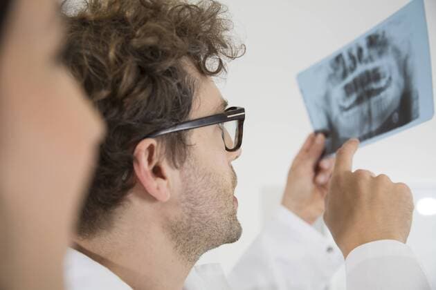 Two dentists discussing x-ray image  FKF001506