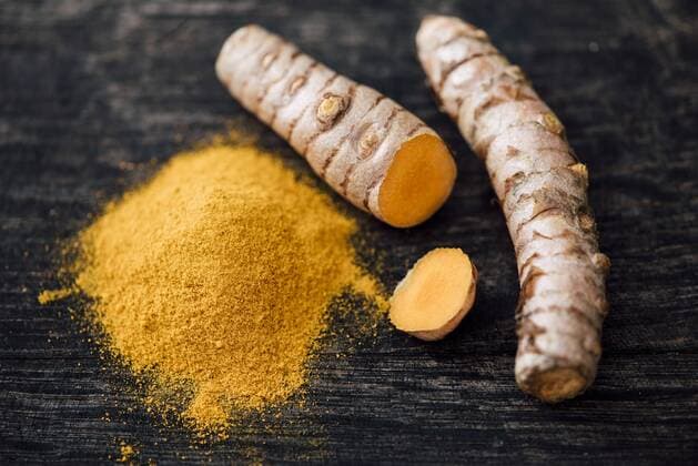 Fresh Curcuma and powder on wood  IPF000275
