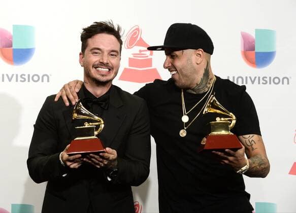 J Balvin, left, with the award for Best Urban Song for Ay Vamos and Nicky Jam, with the award for Best Urban Performance for El Perdon pose in the pressroom during the 16th Annual Latin Grammy Awards at the MGM Grand Garden Arena in Las Vegas, Nevada on November 19, 2015.  LAV20151119621 JIMxRUYMEN